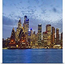 Load image into Gallery viewer, GREATBIGCANVAS Entitled Opera House and Buildings lit up at Dusk Sydney Opera House Sydney Harbor Sydney New South Wales Australia Poster Print, 72&quot; x 32&quot;, Multicolor
